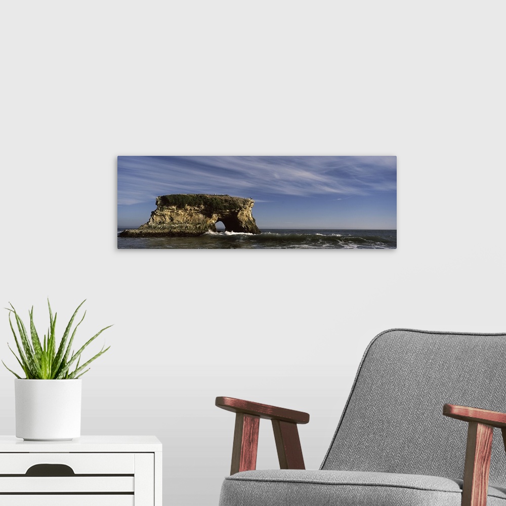 A modern room featuring Rock formations in ocean, Natural Bridges State Beach, Santa Cruz, Santa Cruz County, California,...