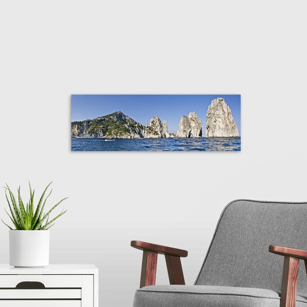 A modern room featuring Rock formations in the sea Faraglioni Capri Naples Campania Italy