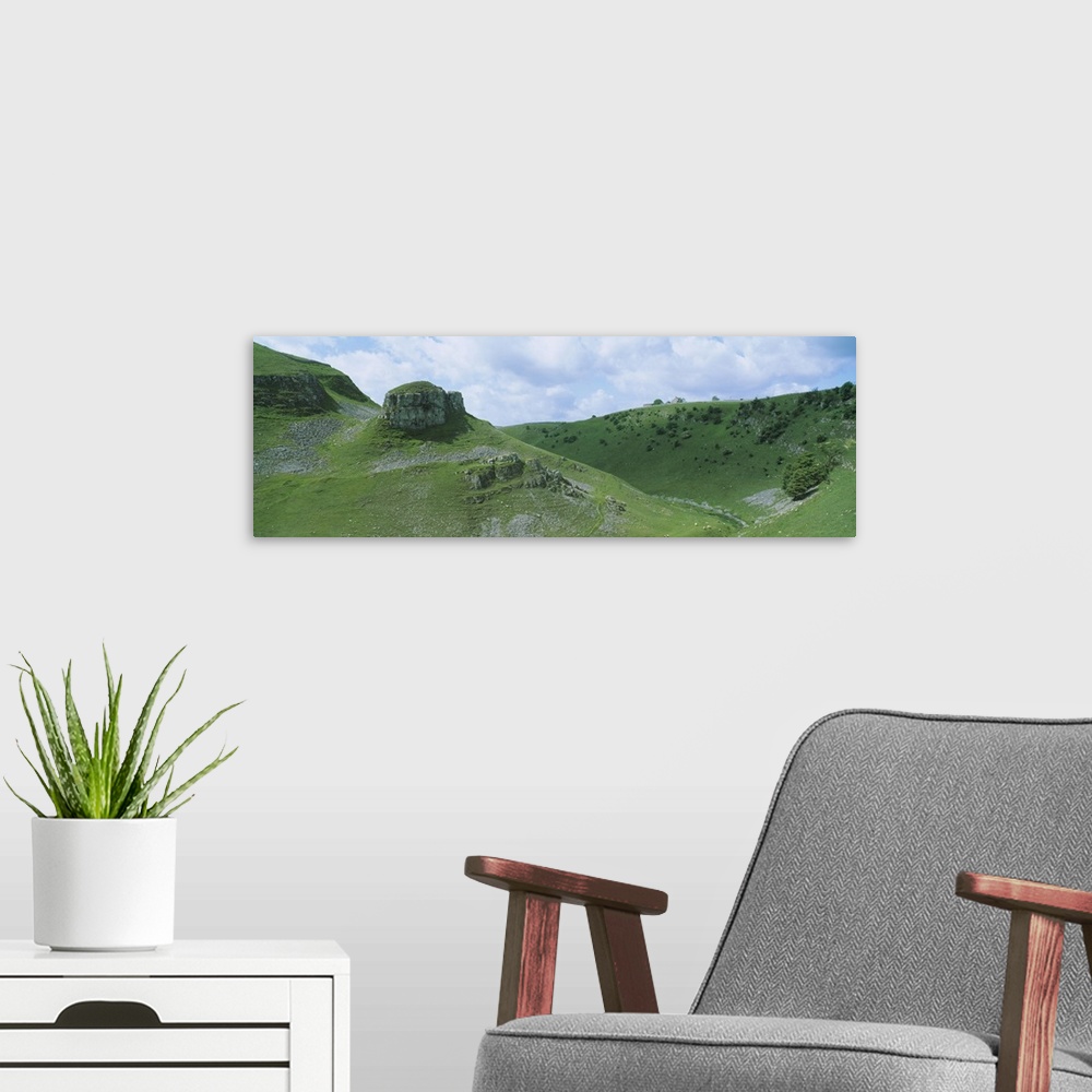 A modern room featuring Rock formations on a hill, Peters Stone, Tansley Dale, Litton, Derbyshire, England