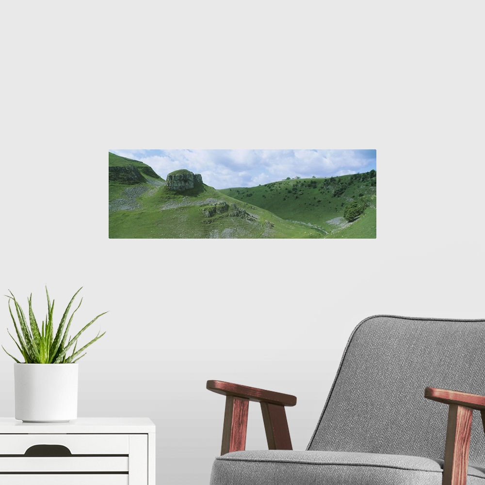 A modern room featuring Rock formations on a hill, Peters Stone, Tansley Dale, Litton, Derbyshire, England