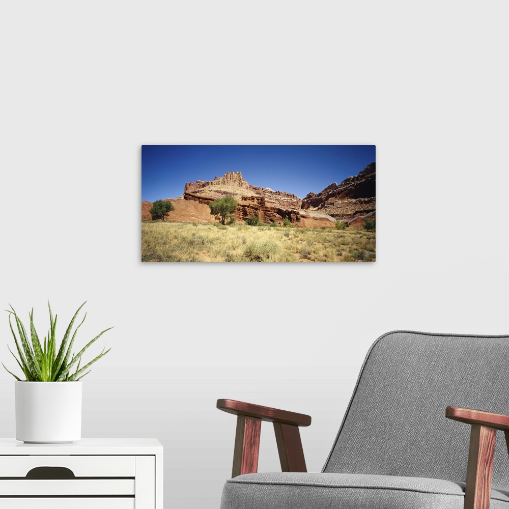 A modern room featuring Rock formations on a landscape, Canyon De Chelly, Arizona