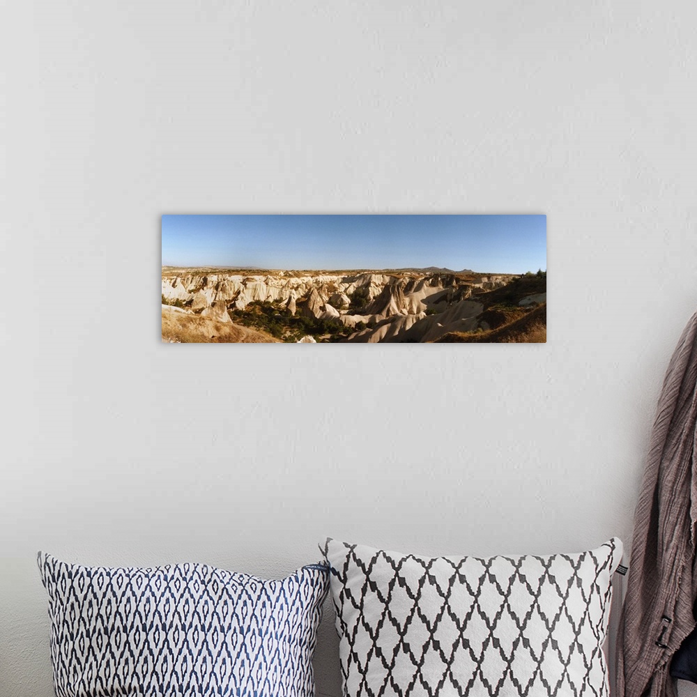 A bohemian room featuring Rock formations on a landscape, Cappadocia, Central Anatolia Region, Turkey