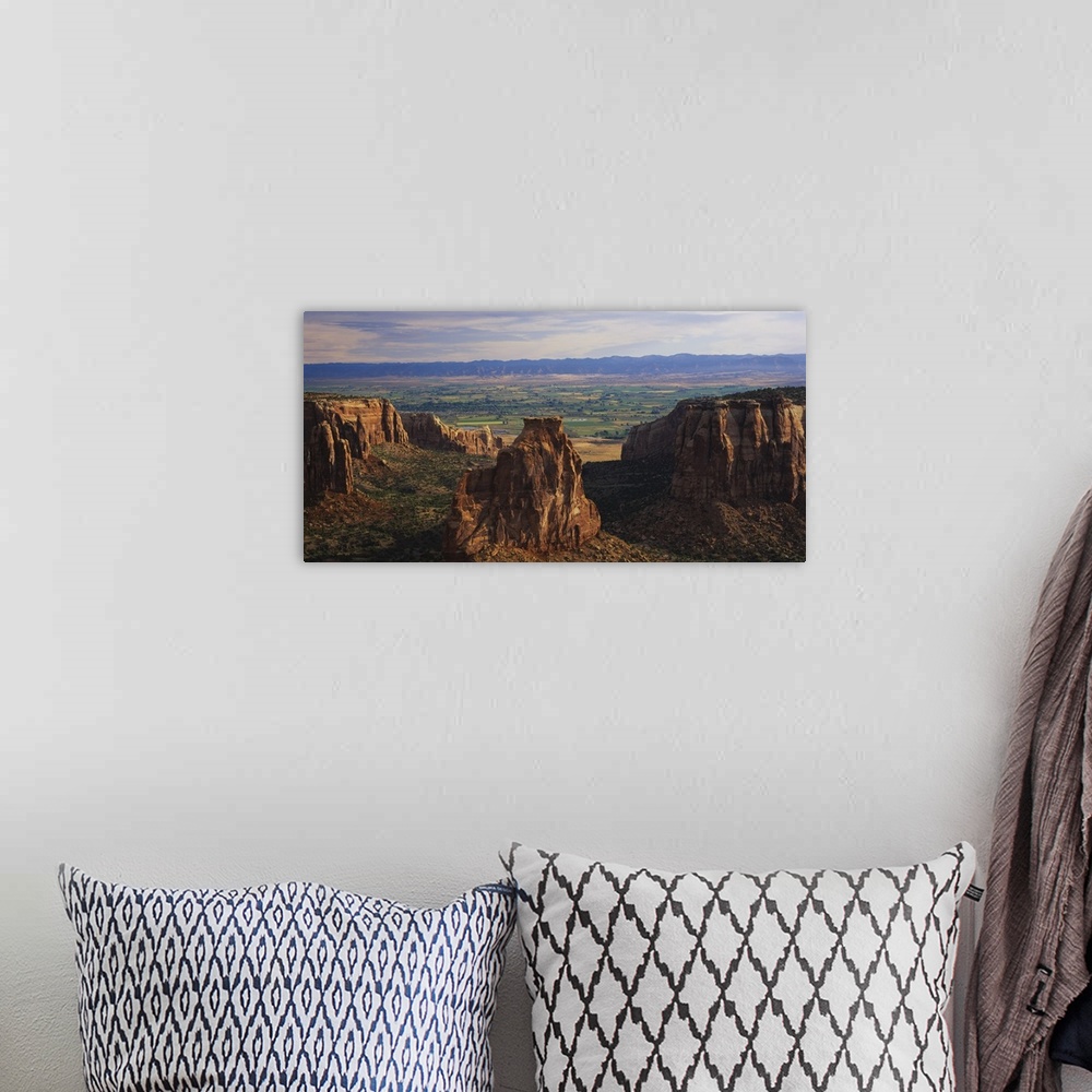 A bohemian room featuring Big, landscape photograph of large rocks of the Colorado National Monument in Grand Junction, Col...