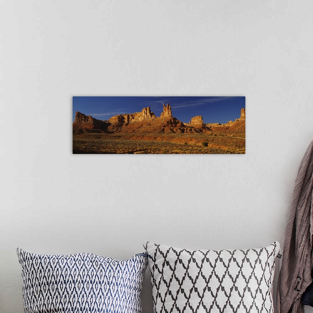 A bohemian room featuring Rock formations on a landscape, Monument Valley Tribal Park, Monument Valley, Arizona