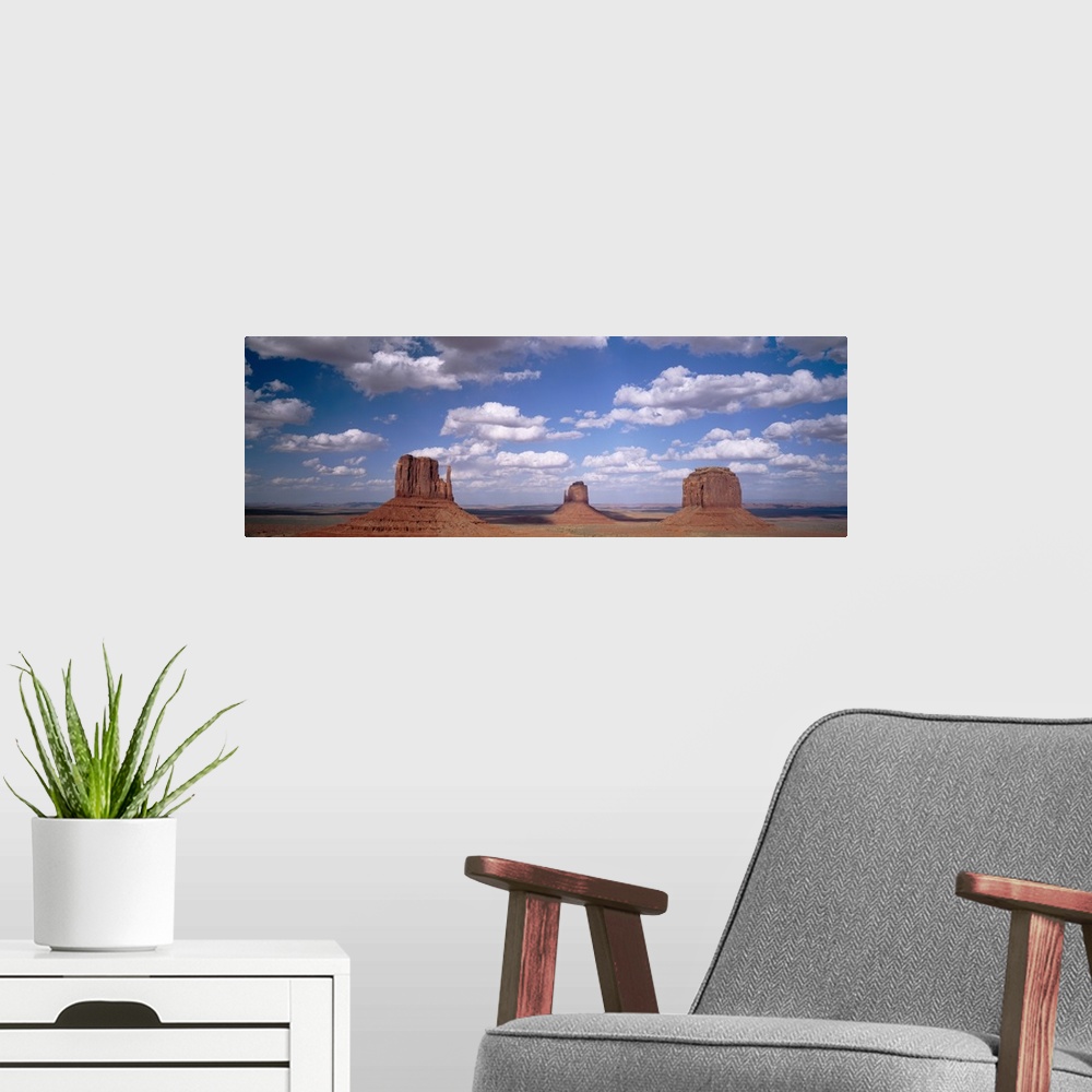 A modern room featuring Rock formations on a landscape, The Mittens, Monument Valley, Arizona