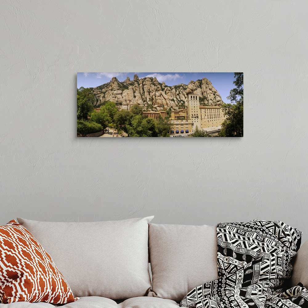 A bohemian room featuring Rock formations over a monastery, Montserrat Monastery, Montserrat Barcelona, Catalonia, Spain