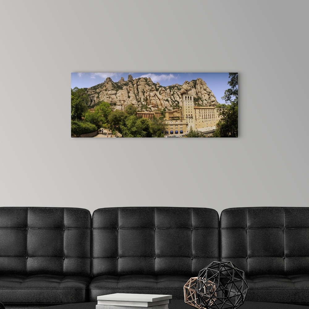 A modern room featuring Rock formations over a monastery, Montserrat Monastery, Montserrat Barcelona, Catalonia, Spain