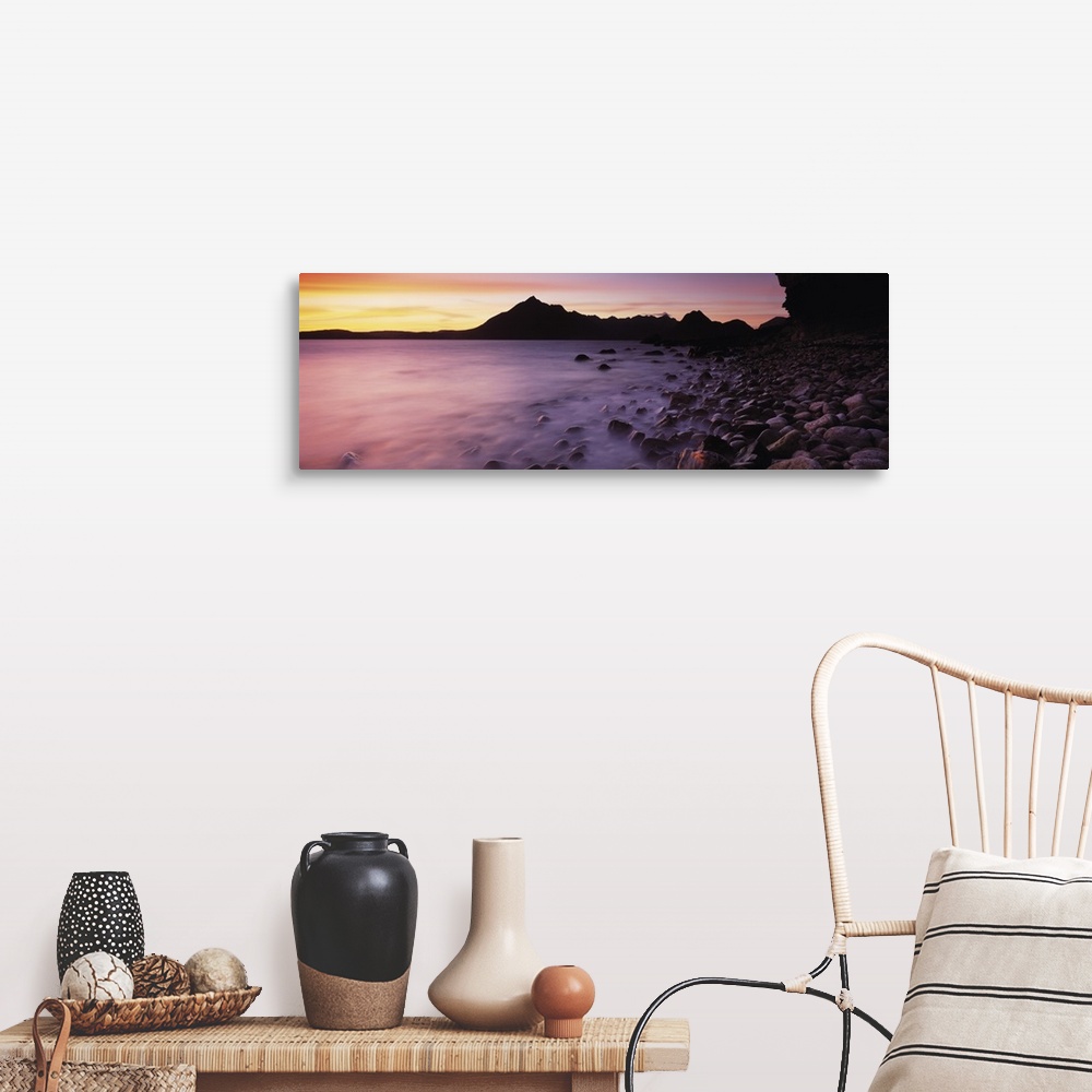A farmhouse room featuring Panoramic photograph of pebble covered shoreline rising from mist with mountain silhouette in the...