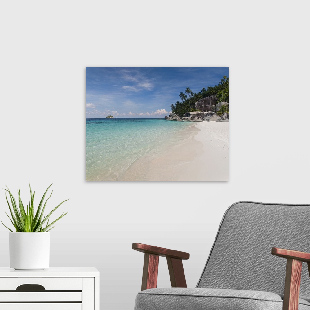 A modern room featuring Square photograph on a big canvas looking down the shoreline of clear blue water and white sands ...