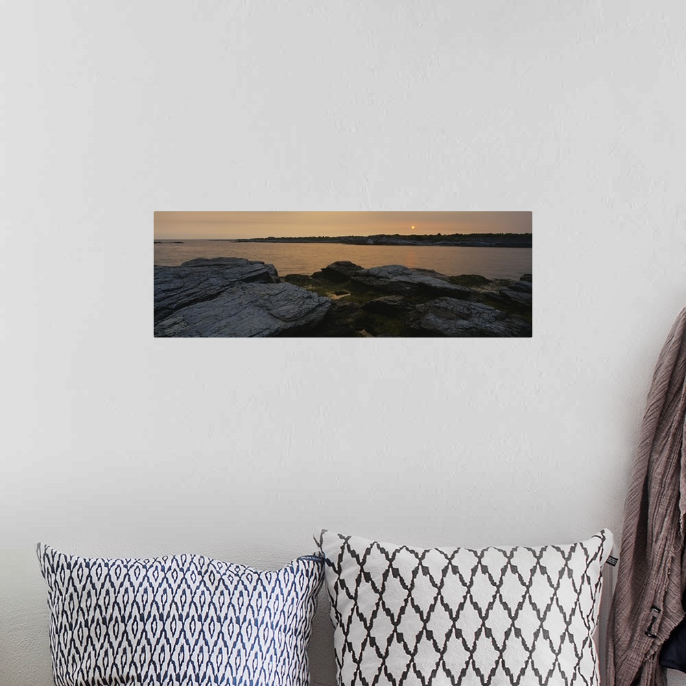 A bohemian room featuring Wide angle photograph taken atop a rocky coast and looking out over a large body of water during ...