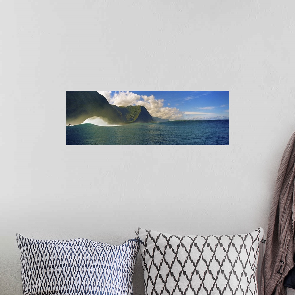A bohemian room featuring Rolling waves with mountains in the background, Molokai, Hawaii