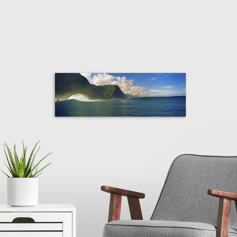 A modern room featuring Rolling waves with mountains in the background, Molokai, Hawaii