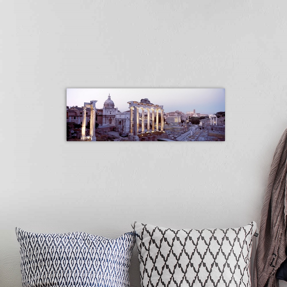 A bohemian room featuring Panoramic photograph of historic ruins with crumbling and eroded stone pillars and buildings.