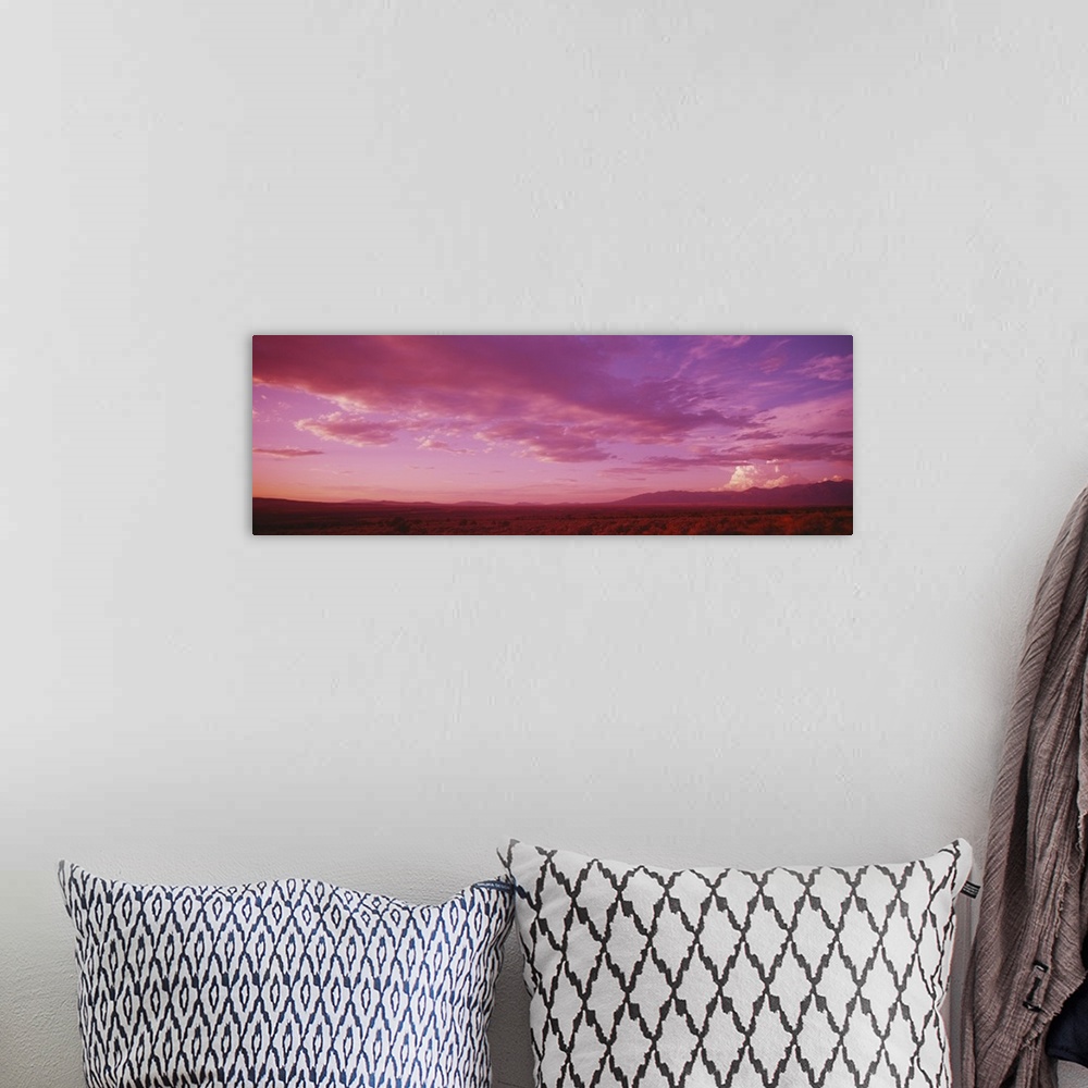 A bohemian room featuring Romantic sky at sunset, Taos Plateau, Taos, New Mexico