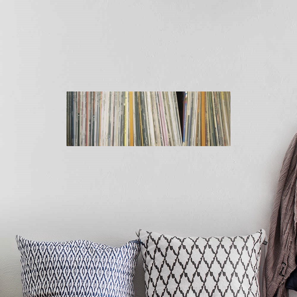 A bohemian room featuring Panoramic photograph shows an abundance of vinyl albums sitting on a shelf.  Notable artists incl...