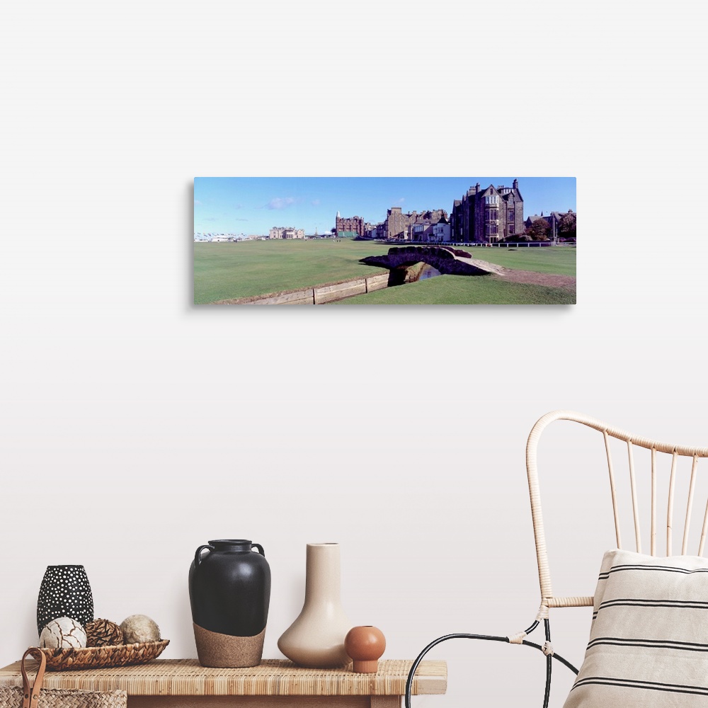 A farmhouse room featuring Panoramic photograph shows Swilcan Bridge connecting two fairways in The Royal and Ancient Golf C...