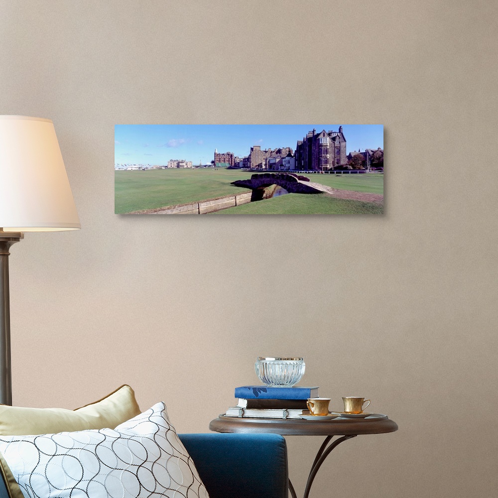 A traditional room featuring Panoramic photograph shows Swilcan Bridge connecting two fairways in The Royal and Ancient Golf C...