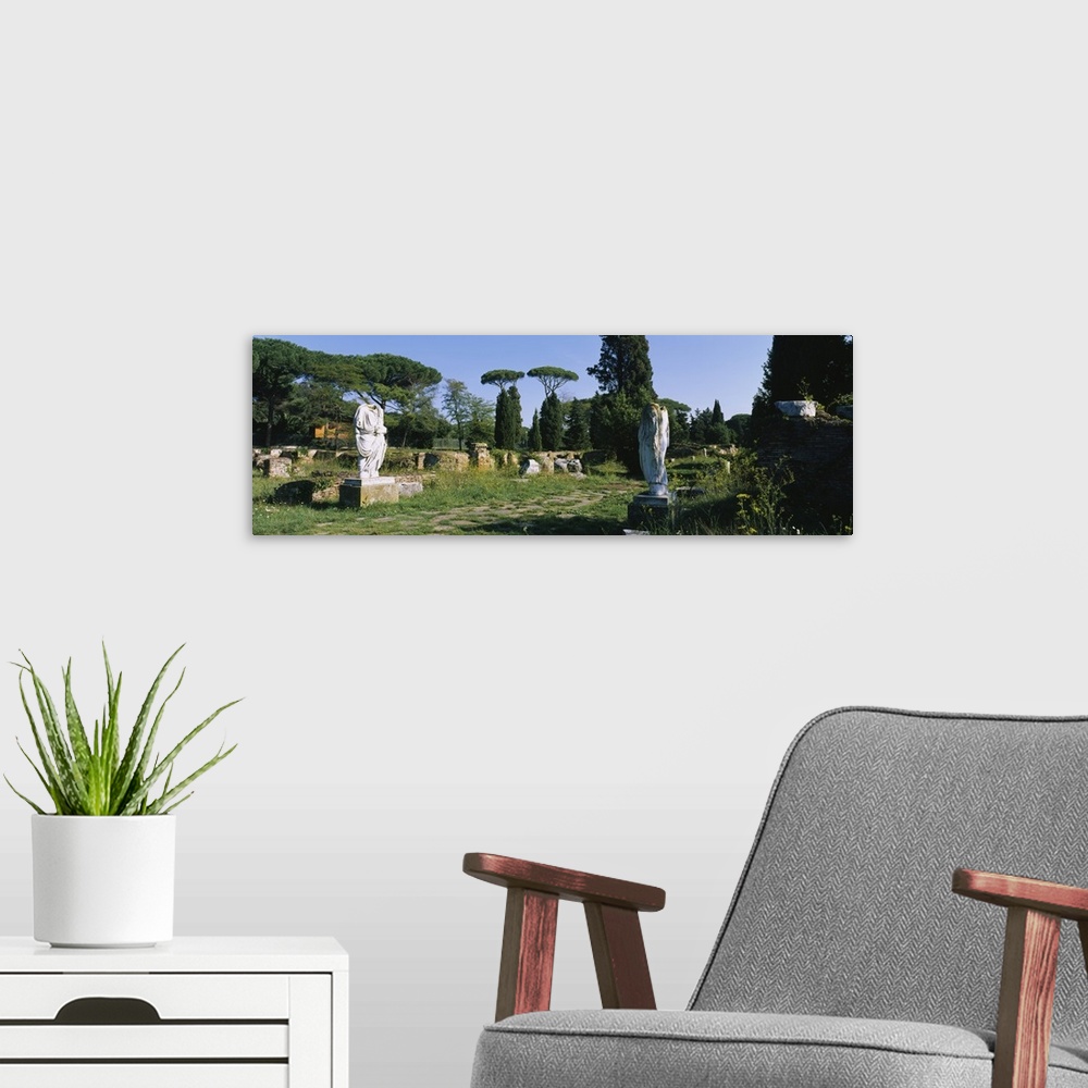 A modern room featuring Ruins of statues in a garden, Ostia Antica, Rome, Italy