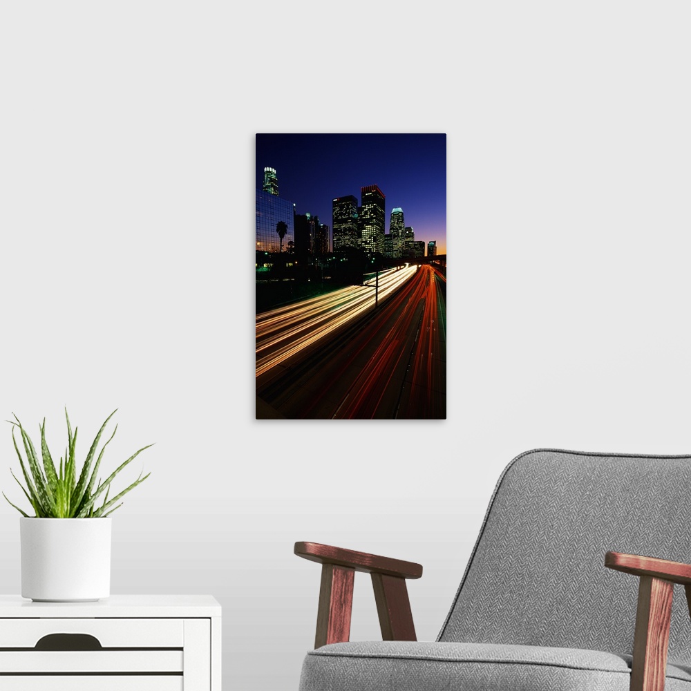 A modern room featuring Vertical photograph of the light trails of cars on the Harbor Freeway in Los Angeles, California ...