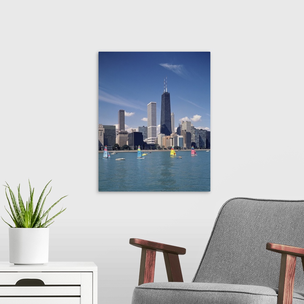 A modern room featuring Vertical photograph of several boats on Lake Michigan in front of Chicago skyscrapers in Illinois.