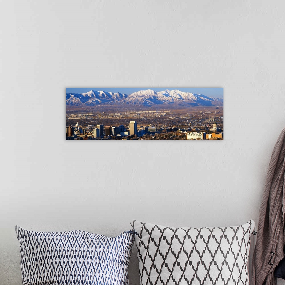 A bohemian room featuring This panorama features the contrasting terrain of Salt Lake City, Utah and mountain peaks.