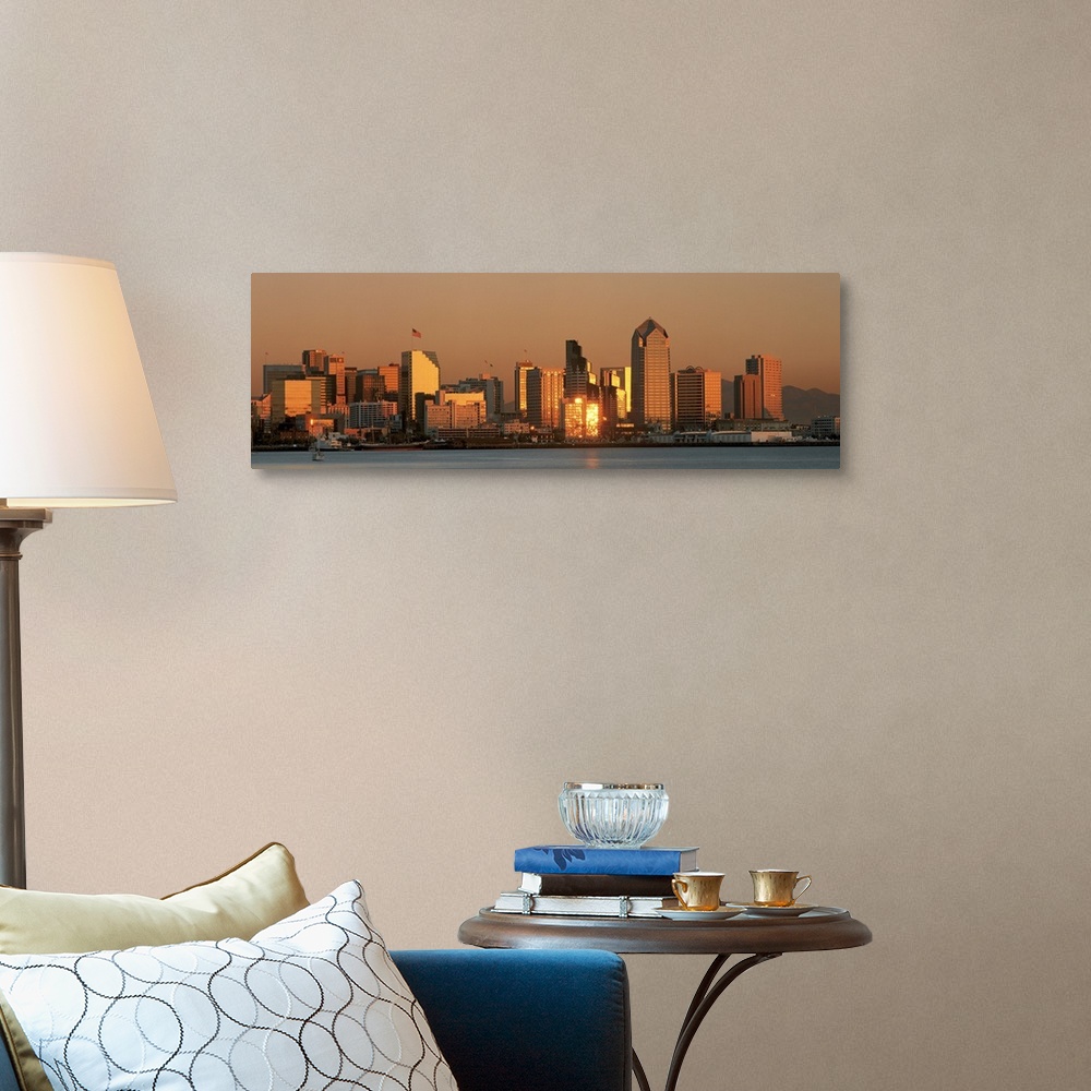 A traditional room featuring This wall art is a panoramic photograph of the city skyline reflecting the fading sunlight.