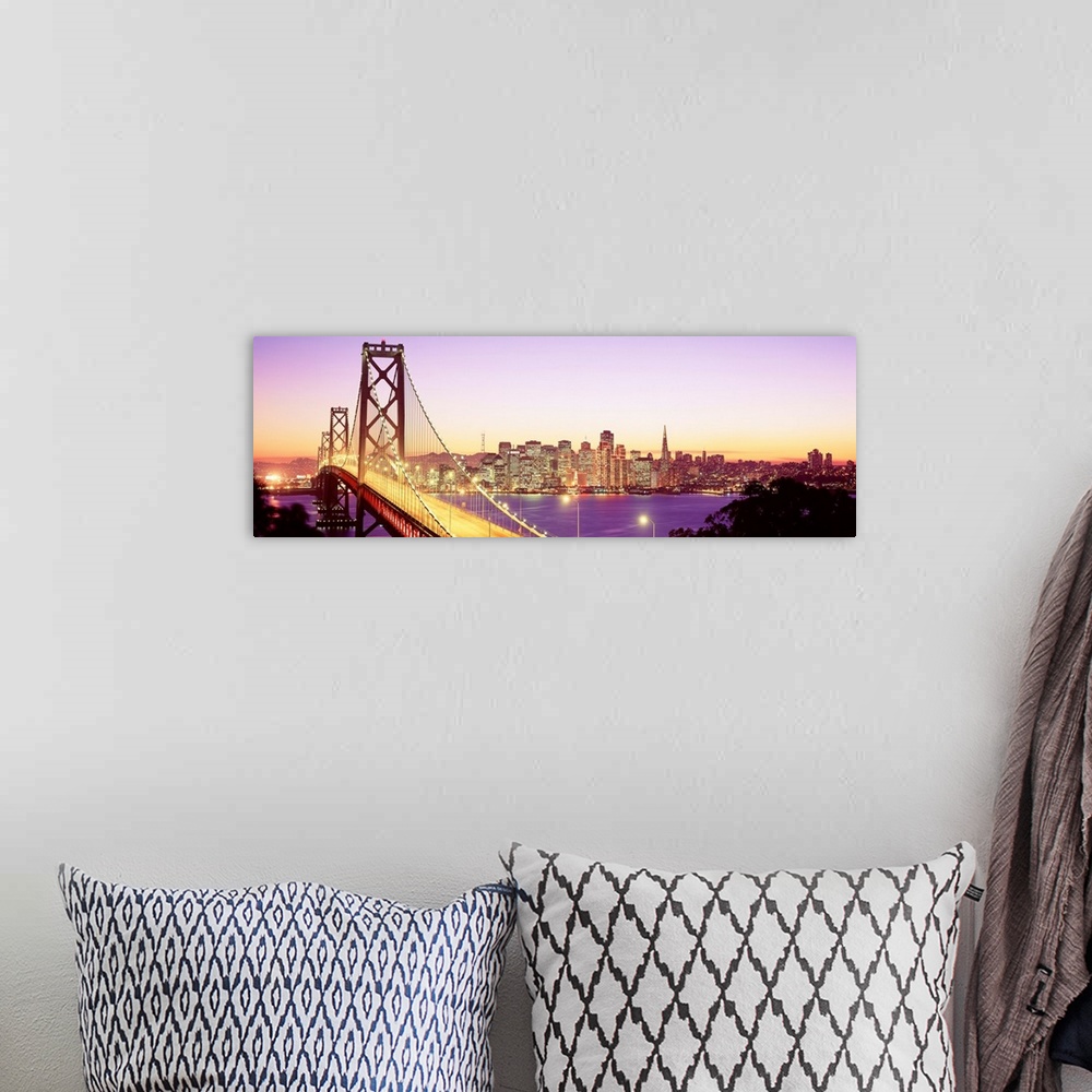 A bohemian room featuring An aerial photograph on panoramic wall art showing the Golden Gate Bridge and the city skyline in...