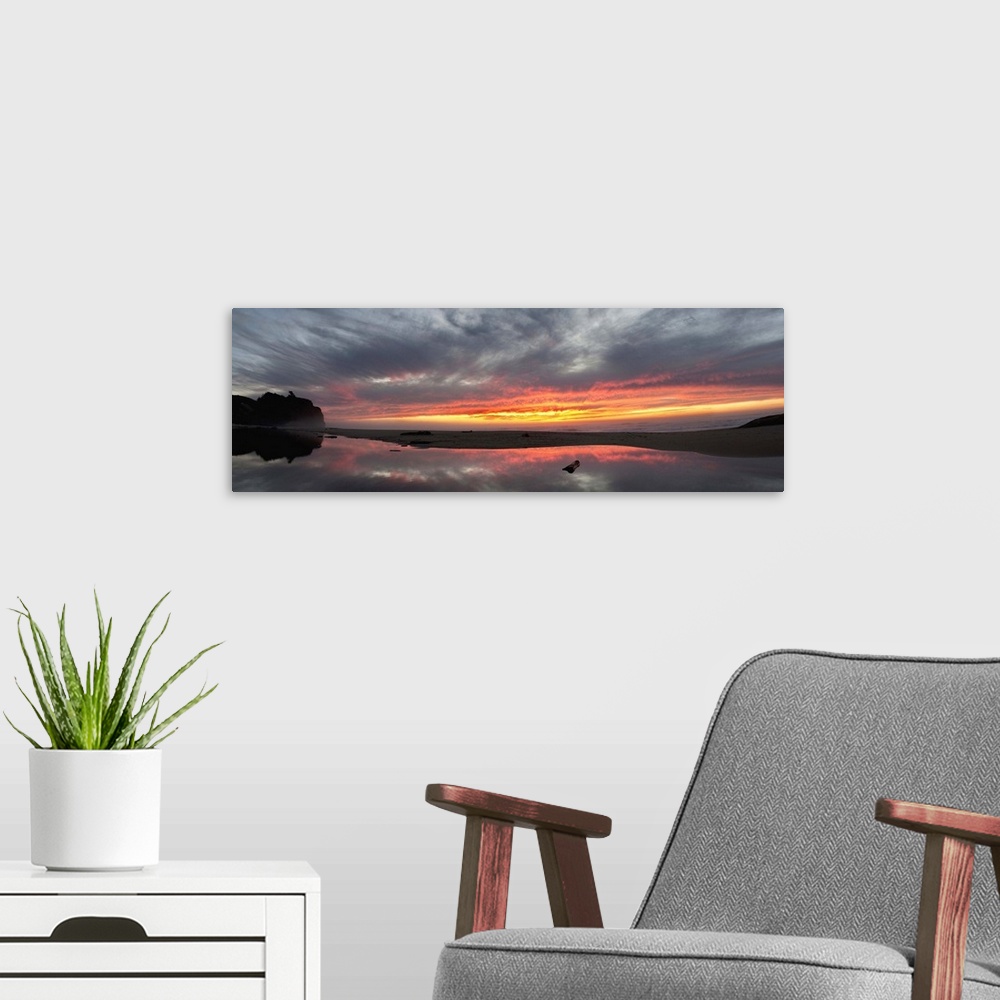 A modern room featuring San Gregorio State Beach at sunset, California