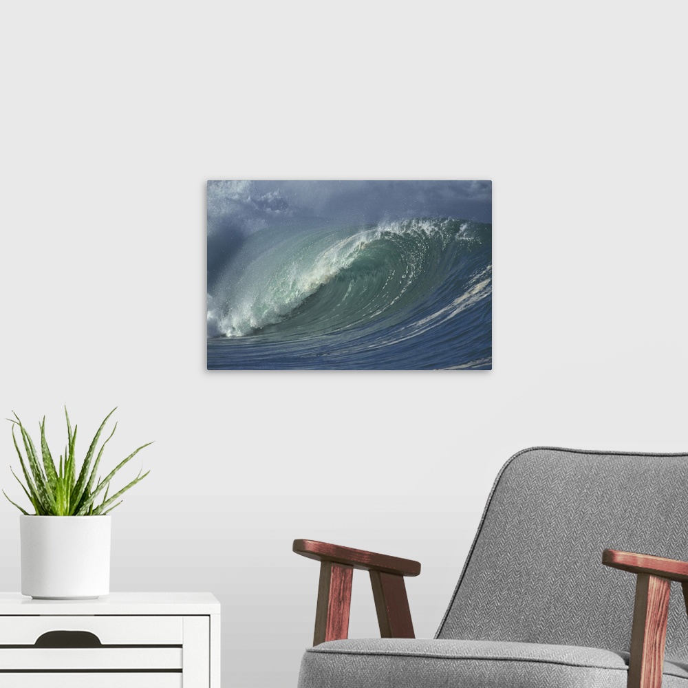 A modern room featuring Photograph taken of a massive wave that is beginning to curve and crash in the ocean.