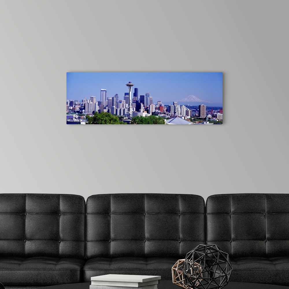 A modern room featuring Panoramic photograph shows the busy skyline for the most populated city in Washington state.  In ...