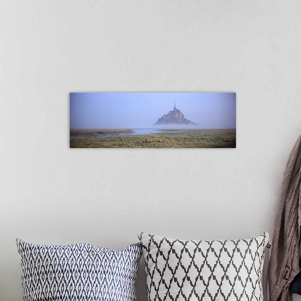 A bohemian room featuring Sheep grazing in meadow at morning, Mont Saint Michel, Normandy, France