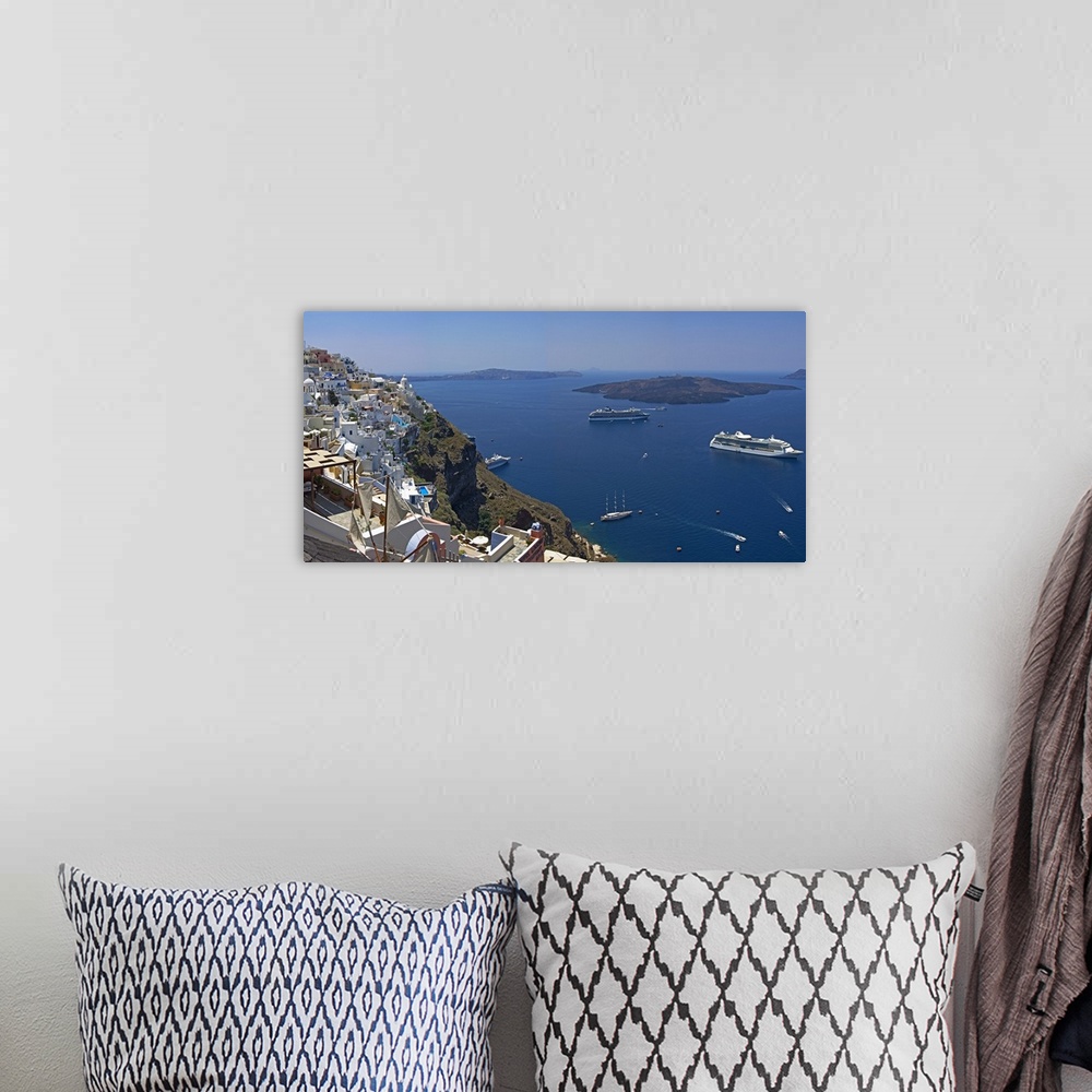 A bohemian room featuring Ships in the sea viewed from a town, Santorini, Cyclades Islands, Greece