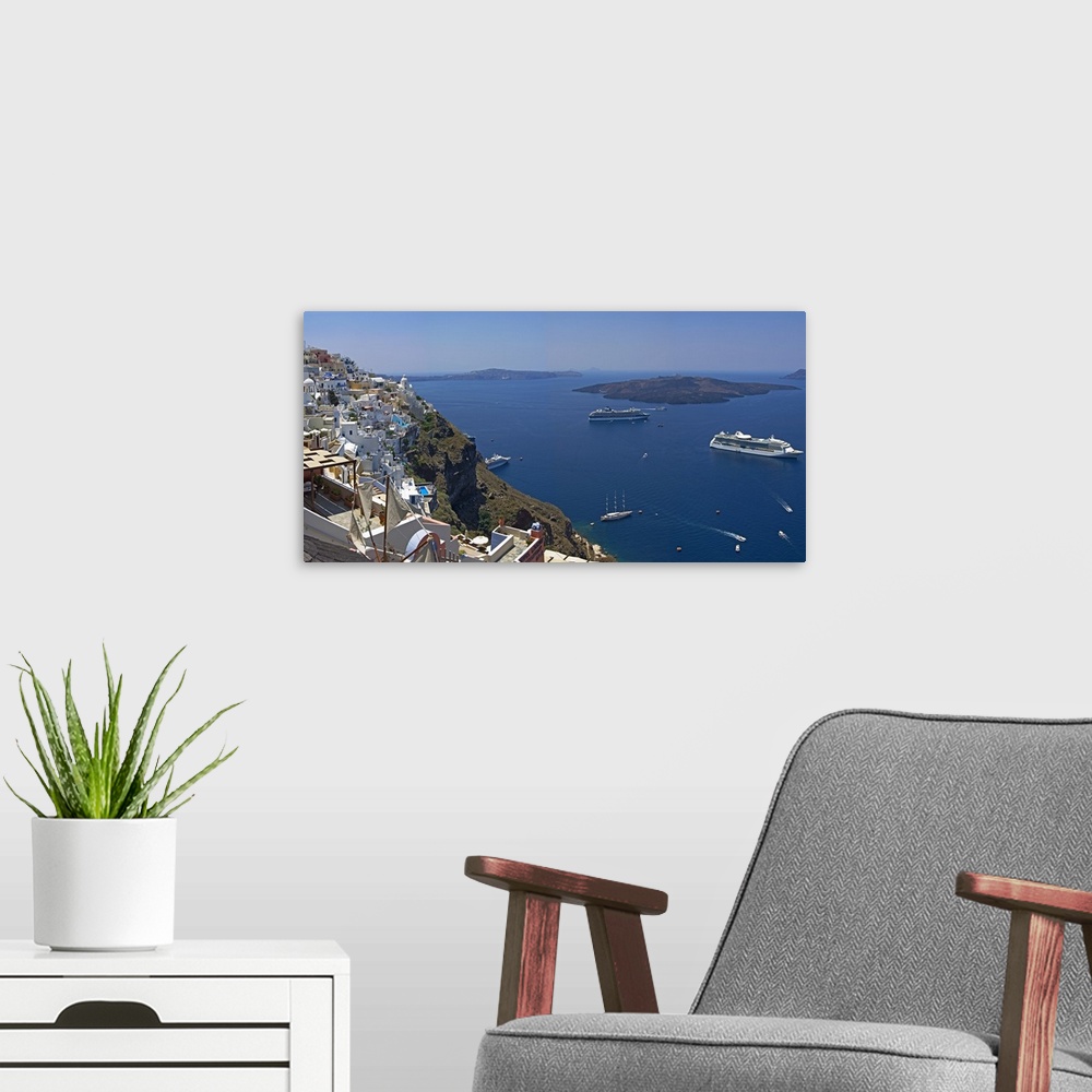 A modern room featuring Ships in the sea viewed from a town, Santorini, Cyclades Islands, Greece