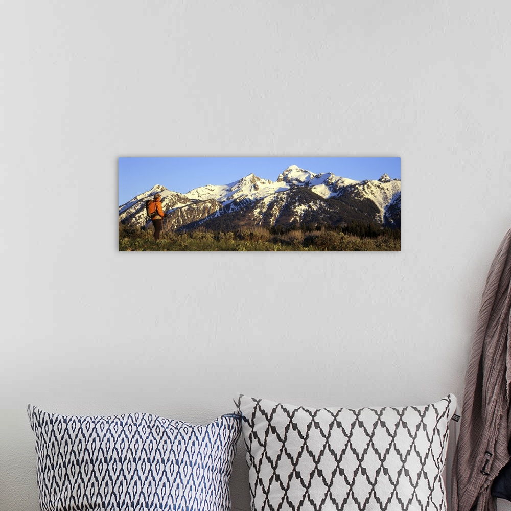 A bohemian room featuring Side profile of a hiker standing on a mountain, Teton Range, Grand Teton National Park, Wyoming
