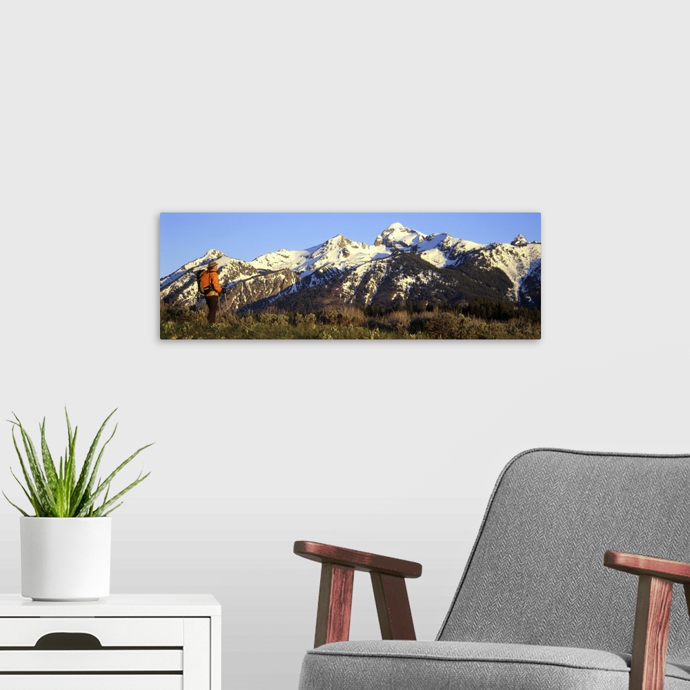 A modern room featuring Side profile of a hiker standing on a mountain, Teton Range, Grand Teton National Park, Wyoming