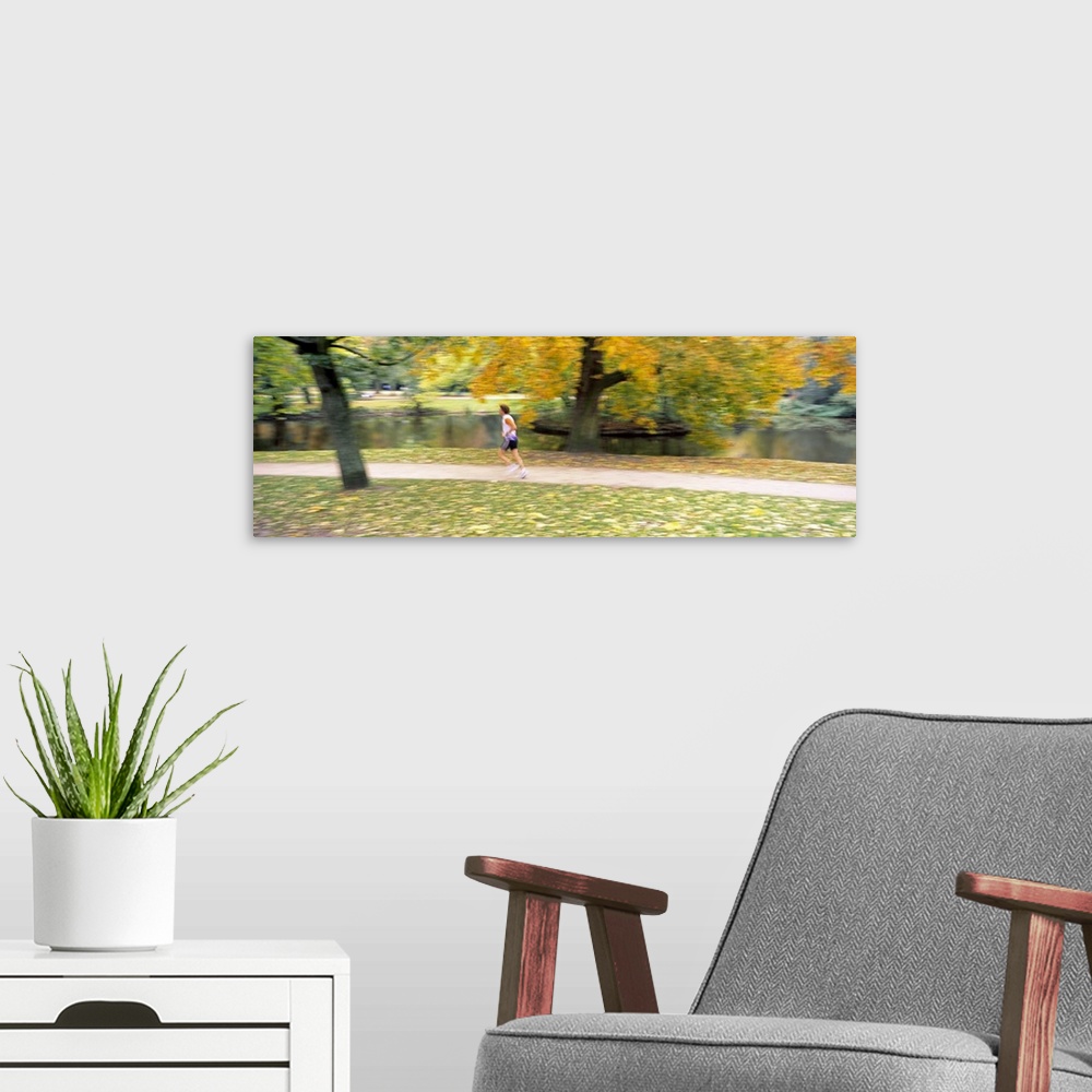 A modern room featuring Side profile of a person jogging in a park, Vondelpark, Amsterdam, Netherlands