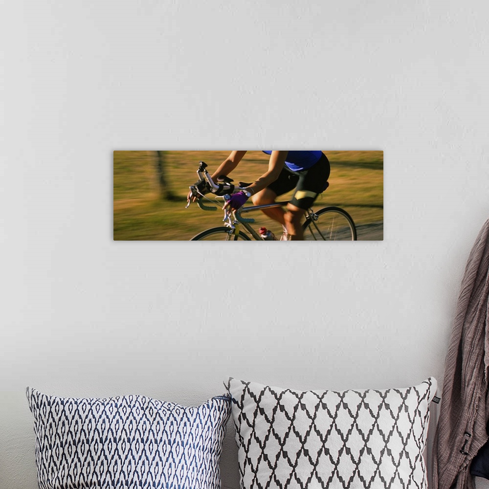 A bohemian room featuring Side profile of a woman cycling