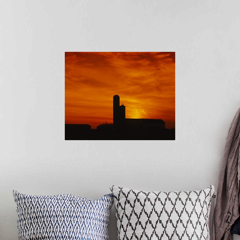 A bohemian room featuring Silhouette of a barn and a silo at sunset, Pennsylvania