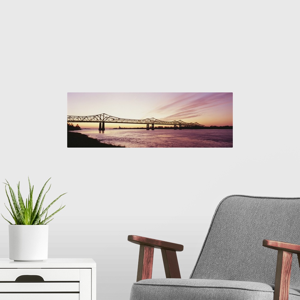 A modern room featuring Silhouette of a bridge over a river, Crescent City Connection Bridge, Mississippi River, Natchez,...