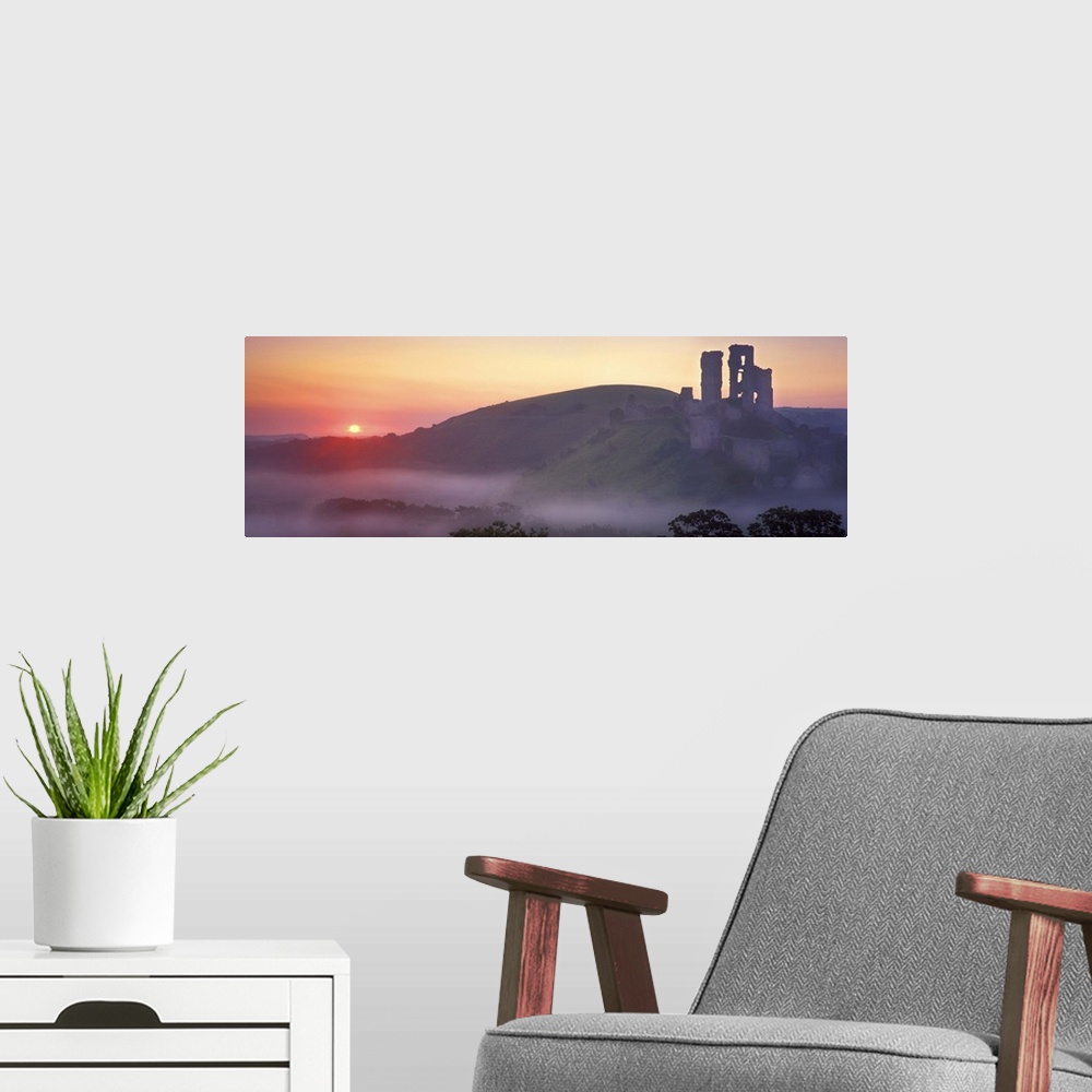 A modern room featuring Silhouette of a castle at dusk, Corfe Castle, Dorset, England