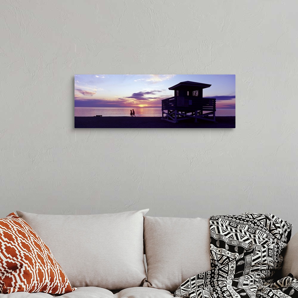 A bohemian room featuring Silhouette of a couple walking on the beach Gulf of Mexico Florida