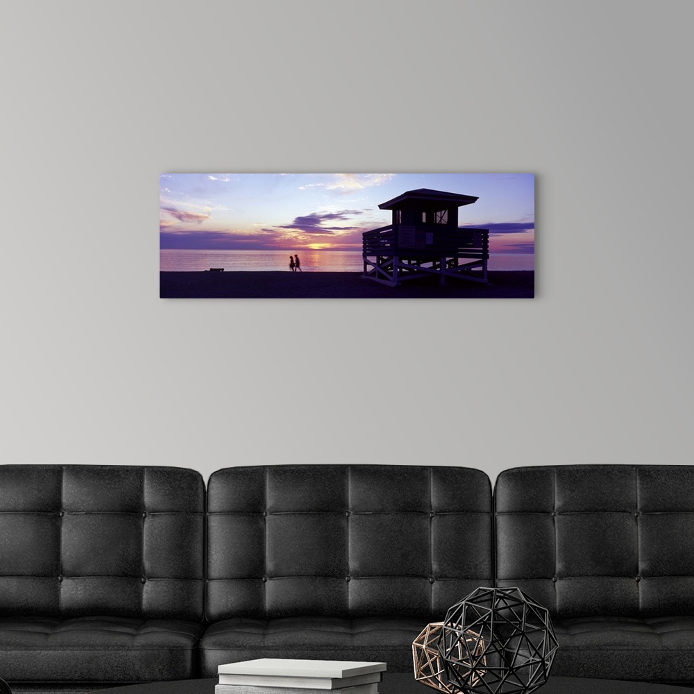 A modern room featuring Silhouette of a couple walking on the beach Gulf of Mexico Florida