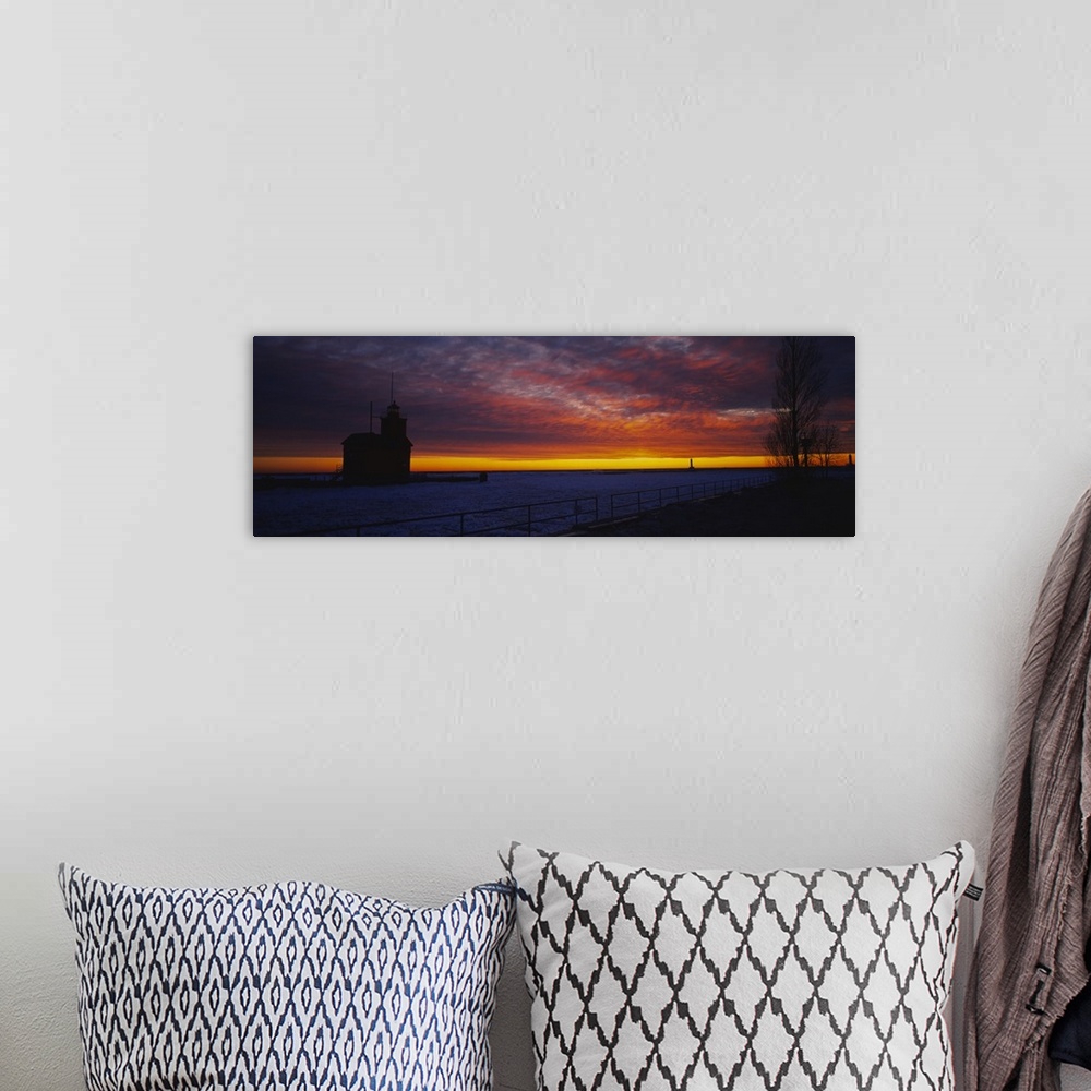 A bohemian room featuring Silhouette of a light house at sunset, Big Red Lighthouse, Holland, Michigan