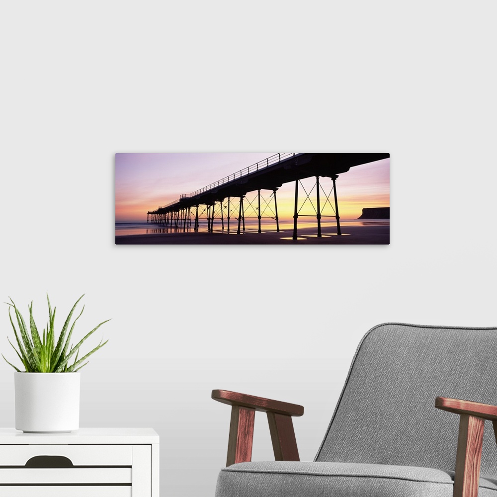 A modern room featuring Silhouette of a pier at dusk Saltburn Pier Saltburn By The Sea Redcar And Cleveland North Yorkshi...