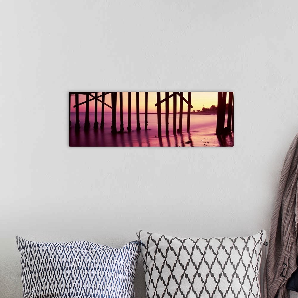 A bohemian room featuring Silhouette of a pier at sunrise, Malibu Pier, Malibu, Los Angeles County, California, USA