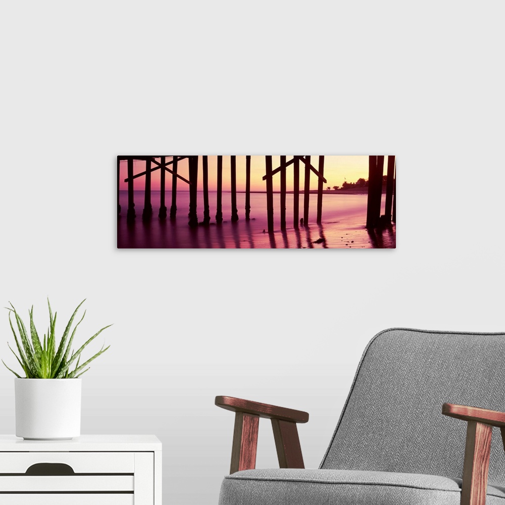 A modern room featuring Silhouette of a pier at sunrise, Malibu Pier, Malibu, Los Angeles County, California, USA