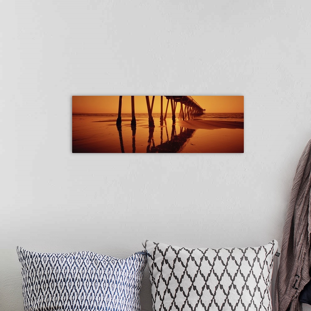 A bohemian room featuring Big, panoramic photograph taken at an angle of Hermosa Beach Pier during a golden sunset, in Herm...
