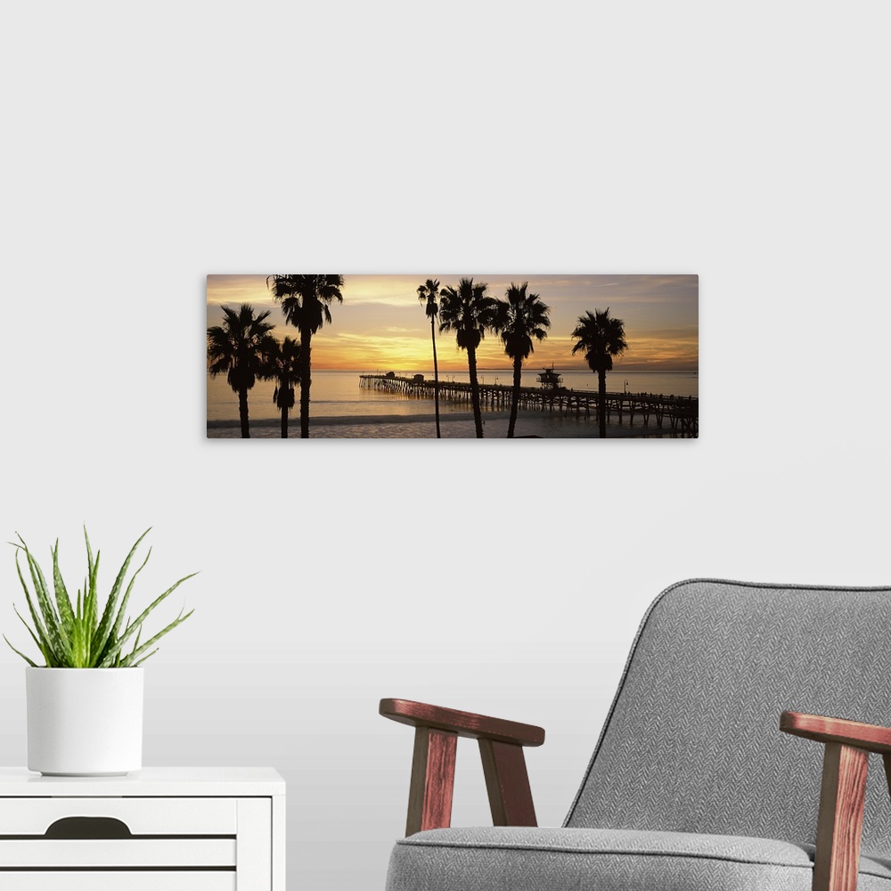 A modern room featuring Panoramic image of the San Clemente Pier at sunset in Los Angeles, California.
