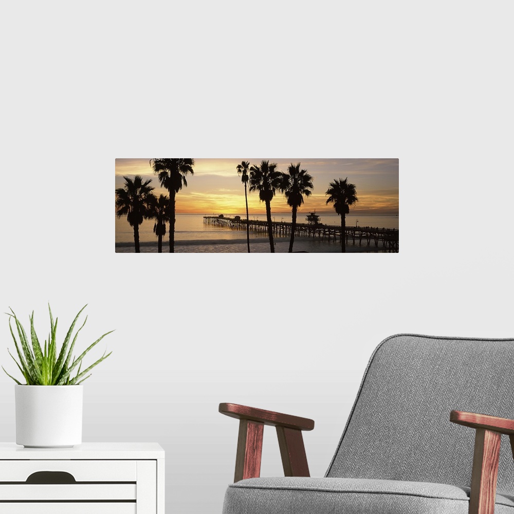 A modern room featuring Panoramic image of the San Clemente Pier at sunset in Los Angeles, California.