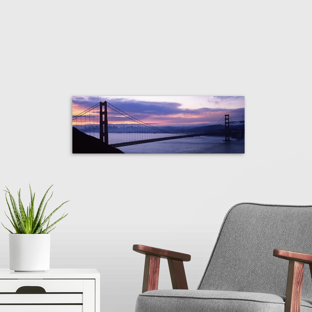 A modern room featuring Silhouette of a suspension bridge at dusk, Golden Gate Bridge, San Francisco, California,